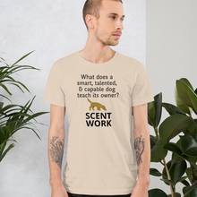 Load image into Gallery viewer, Dog Teaches It's Owner Scent Work T-Shirt - Light